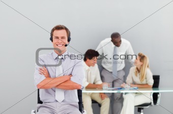 Young and handsome businessman with a headset on
