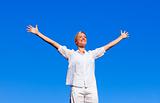Happy woman feeling free with open arms
