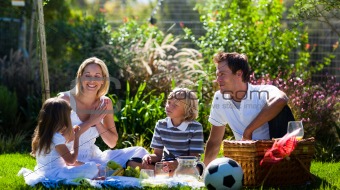 Family picnicing in garden
