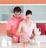 Attractive lovers cooking at home