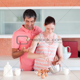 Attractive man and woman cooking at home