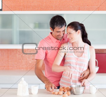 Two lovers cooking at home