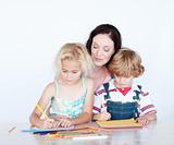Mother and children writing together
