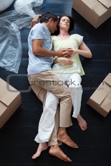 Lovers sleeping on the floor