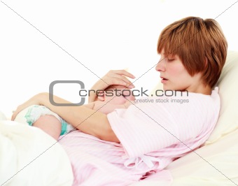 Patient caring for her newborn baby in bed