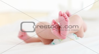 Newborn baby lying in bed