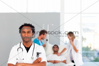 Serious doctor looking at the camera with copy-space