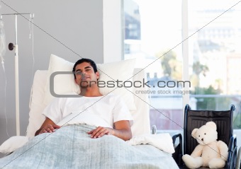 Hispanic patient resting in bed