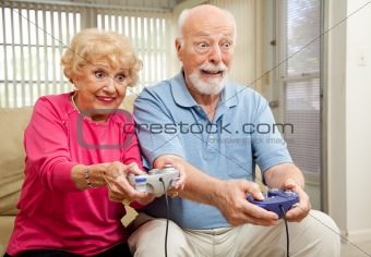 Senior Couple Play Video Games