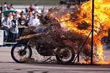 Stunt rider and wall of flames