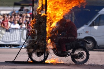 Stunt rider and wall of flames