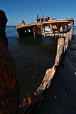 A sunken wreck rusting into the ocean