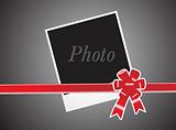 red ribbon and card on gray background