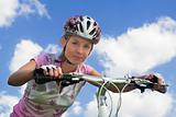 Girl with bicycle. Close shot
