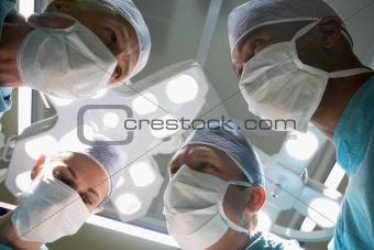 Low Angle View Of Four Surgeons