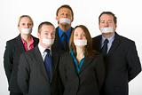 Group Of Business People With Their Mouths Taped Shut