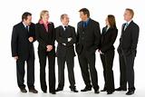 Group Of Business People Standing Around Conversing 