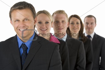 Group Of Business People In A Line Smiling 