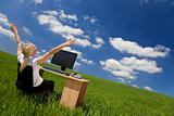 Businesswoman Using Computer In A Green Field