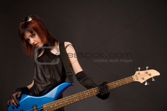 Sexy girl with bass guitar