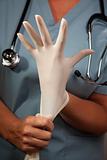 Abstract Image of Doctor Putting on Latex Surgical Gloves.