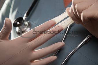 Abstract Image of Doctor Taking Off Latex Surgical Gloves.
