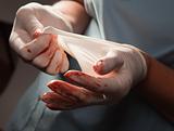 Abstract of Doctors Bloody Surgical Gloves and Scrubs.