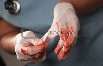 Abstract of Doctors Bloody Surgical Gloves, Scrubs and Stethoscope.