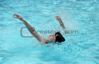 Child Swimming in a Pool