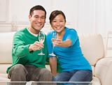 Attractive Asian Couple Toasting
