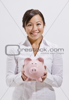 Beautiful Asian Woman Holding Piggy Bank