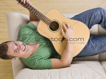 Attractive Man Playing Guitar
