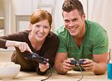 Happy Young Couple Playing Video Games