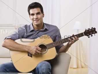 Relaxed Man Playing Guitar