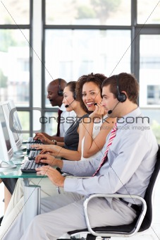 Smiling African-American businesswoman working in a call center