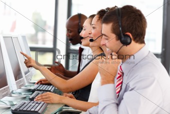 Attractive businessman working in a call center