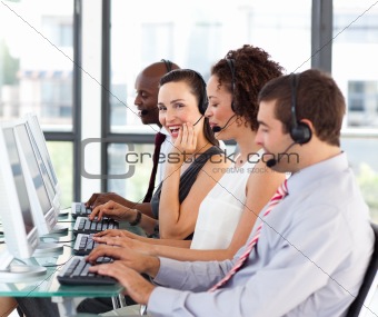 Beautiful young businesswoman in a call center