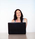Portrait of a smiling woman with her laptop