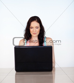 Serious woman focused on her laptop