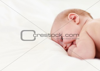 Baby sleeping in bed