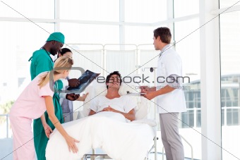 Doctors caring to a patient