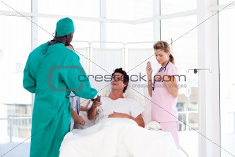 Doctors with a patient in the hospital