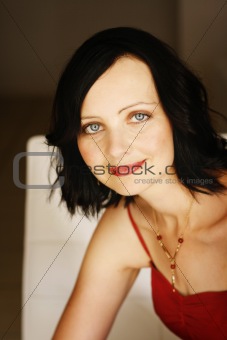 Portrait of a beautiful woman in a red outfit.