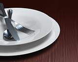 Clean white dishes & cutlery on dark woodgrain table