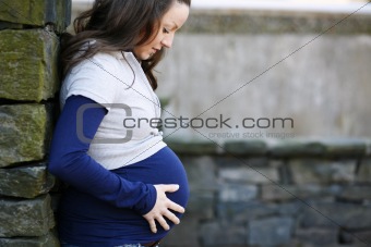 Young pregnant woman outdoors.