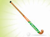 field hockey stick and ball with white rays background