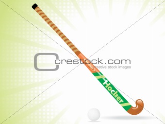 field hockey stick and ball with white rays background