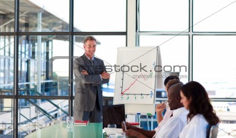 Businessman in a presentation with folded arms