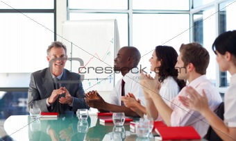 Business people applauding in a meeting