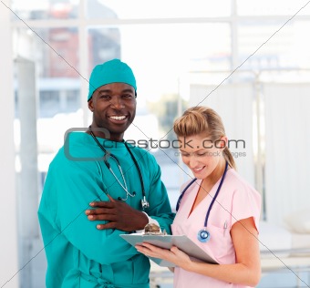 Surgeon and nurse in hospital